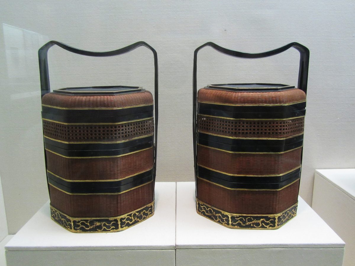 Handwoven bamboo basket in a museum display