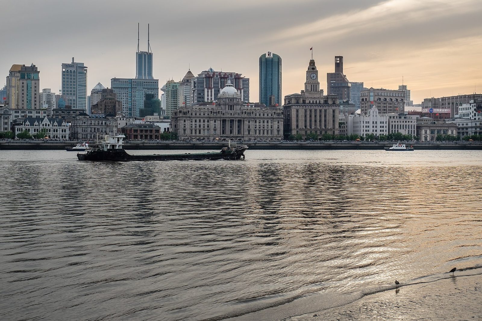 The Bund waterfront in Shanghai with historic buildings across the Huangpu River