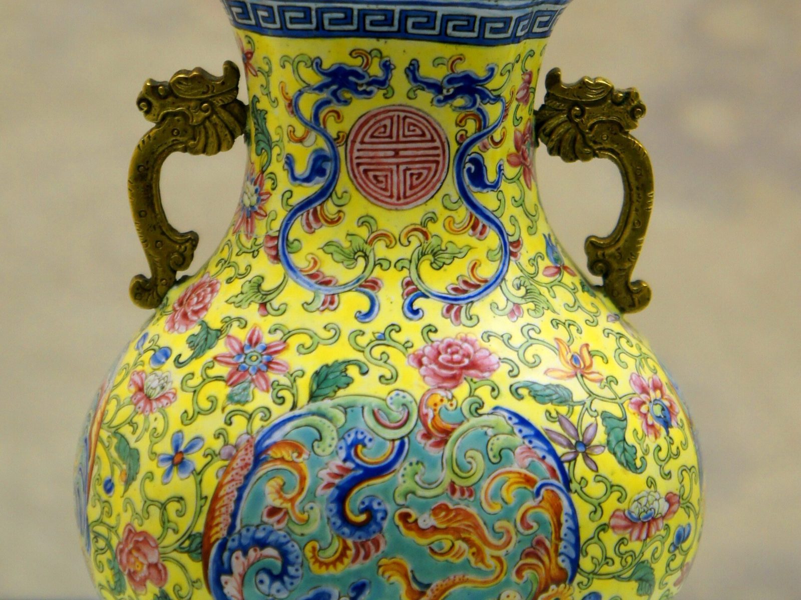Canton enamel (guangcai) porcelain vase with yellow ground, floral scrolls and dragon handles