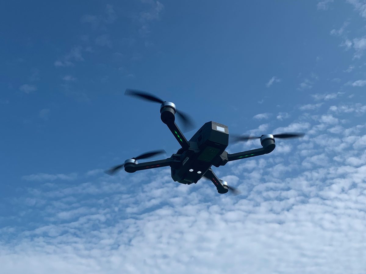 Camera drone in flight against the sky