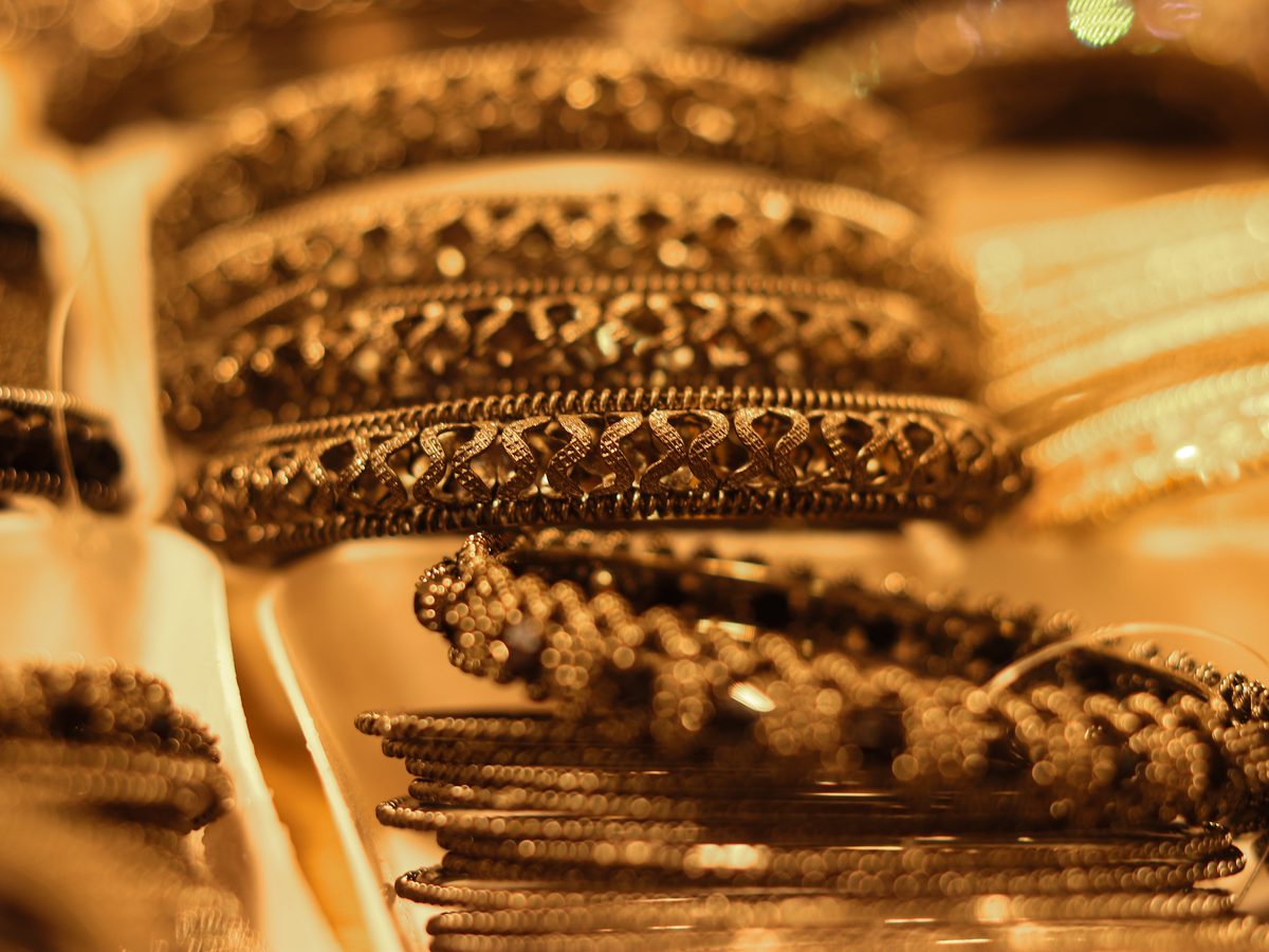 Gold bangles in a jewelry shop display